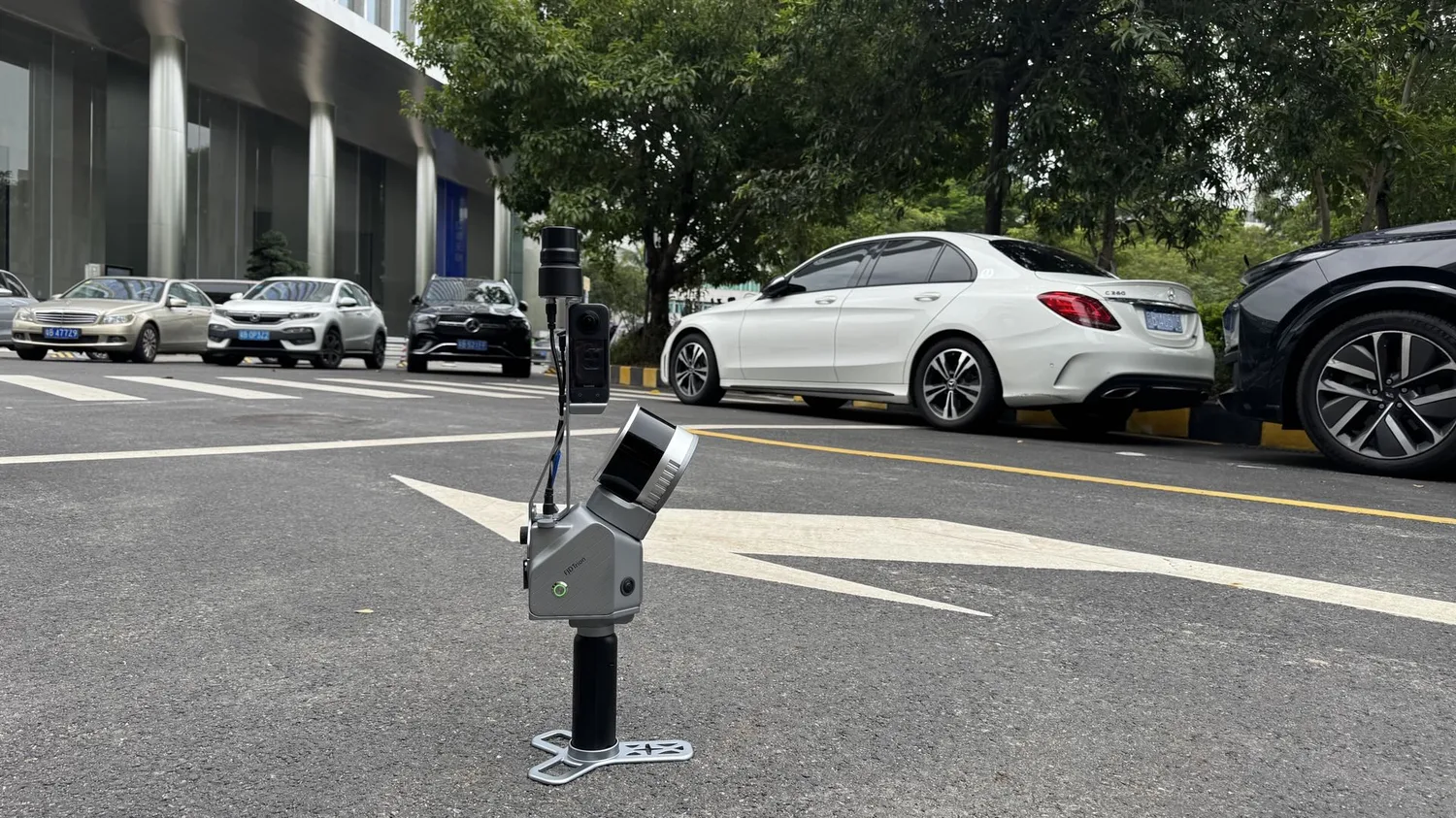 Trion scanner mounted on a car roof on a city street