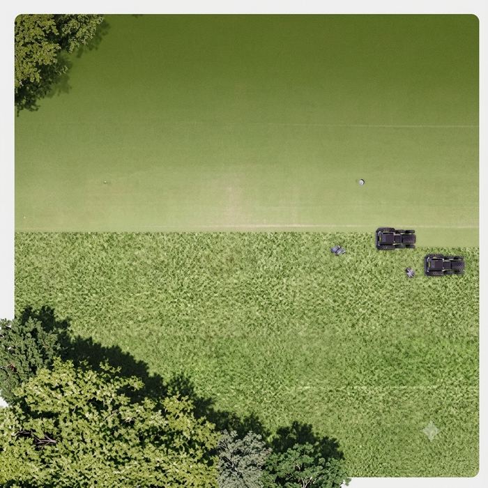 Aerial view of Nortec Explore X1 robots mowing a field