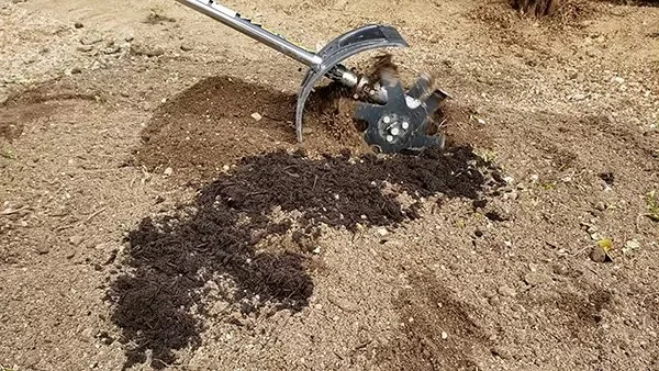 IDECH Quick Tiller in use - tilling soil