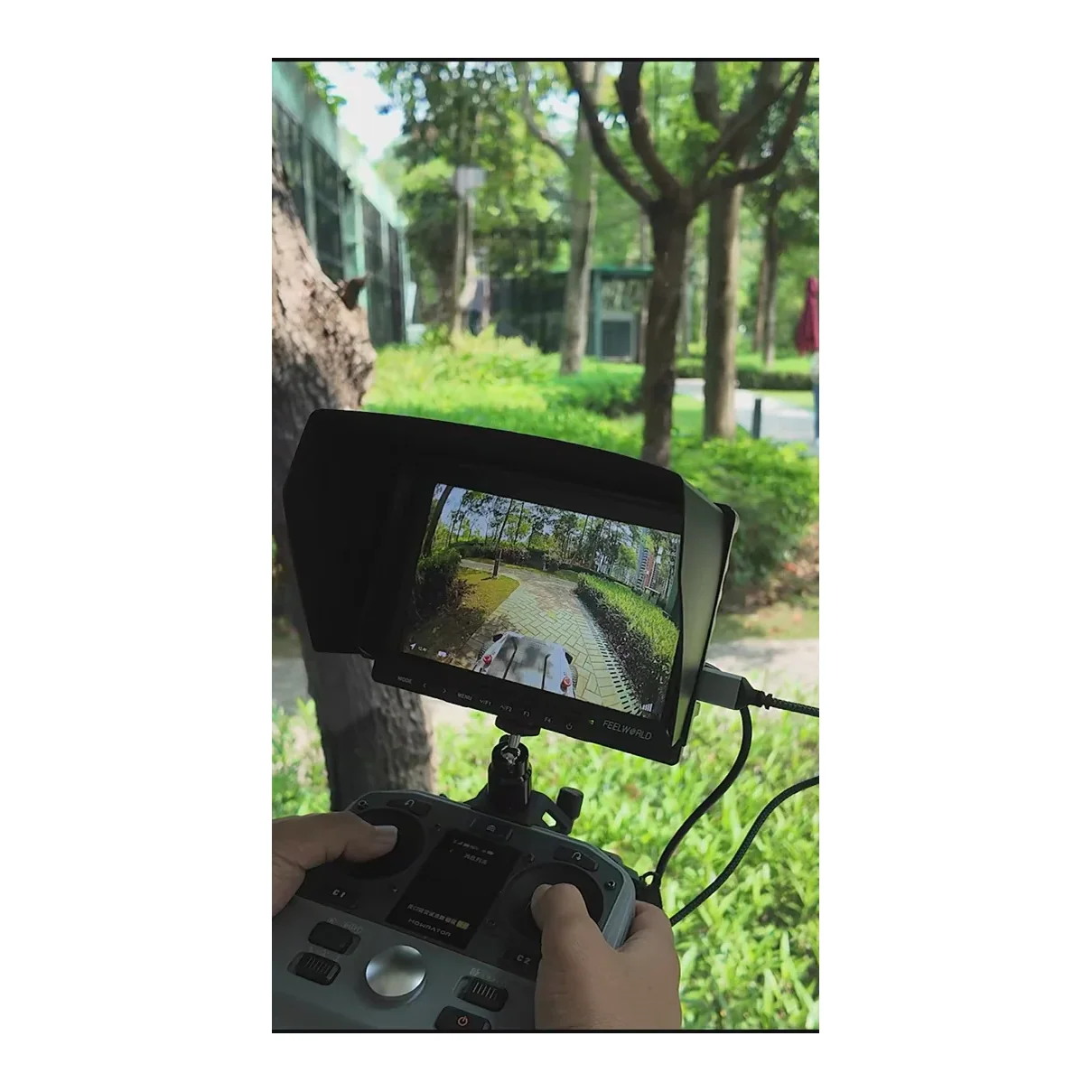 Mowrator MOWFUN FPV in use with the remote control